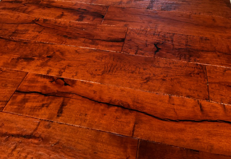 Wide plank engineered mesquite floor that is handscraped